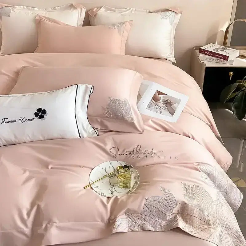 Luxury pink satin duvet cover and pillowcase with silver leaf and black embroidered text in decorbites embroidered cotton bedding set