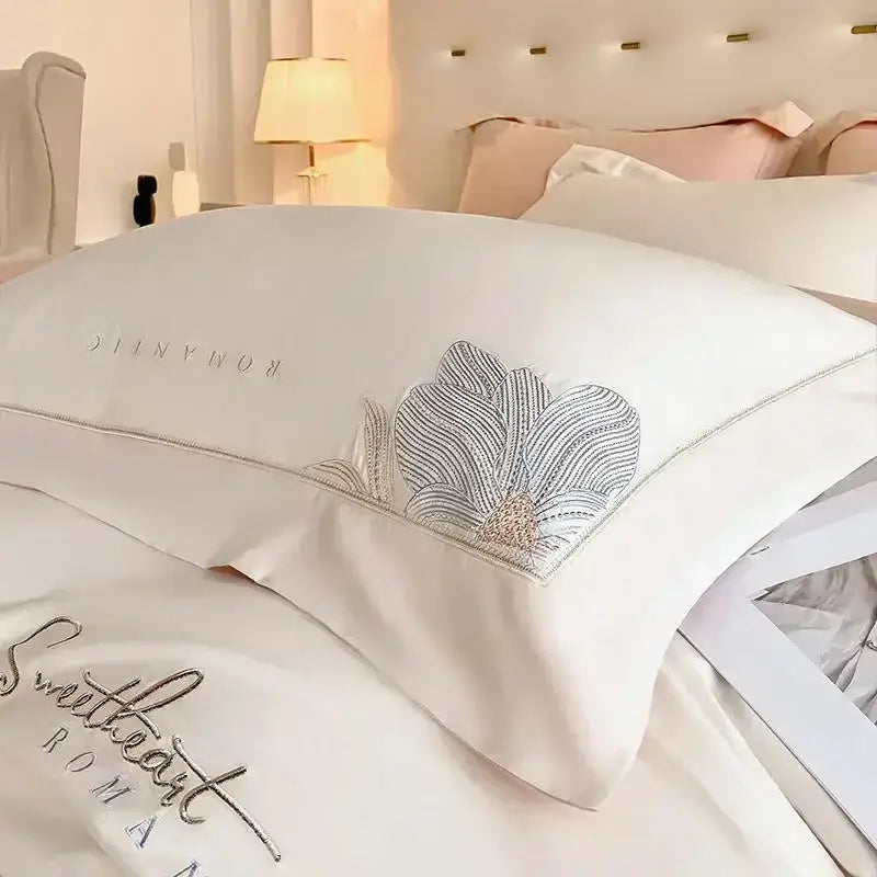 Luxury white satin pillowcase with silver and rose gold embroidered floral design from decorbites embroidered cotton bedding set