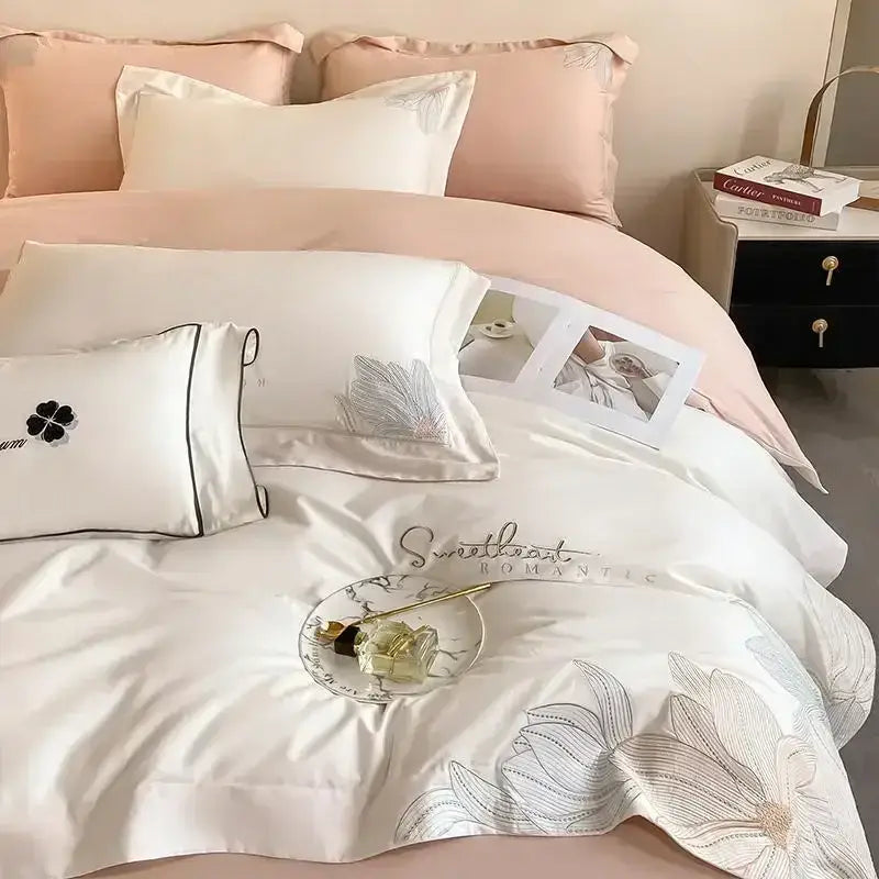 Luxury white satin duvet cover with silver floral embroidery and sweetheart stitching in decorbites embroidered cotton bedding set