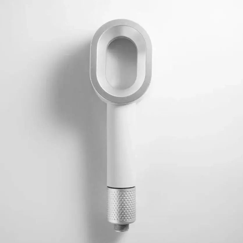 Luxury white and silver handheld shower head with sleek modern design and textured silver nozzle for bathroom use