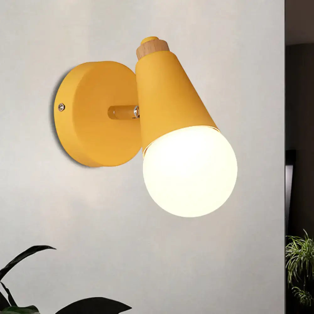 Yellow macaron loft sweet cone wall sconce with a matte metal finish and wood accent for corridor lighting