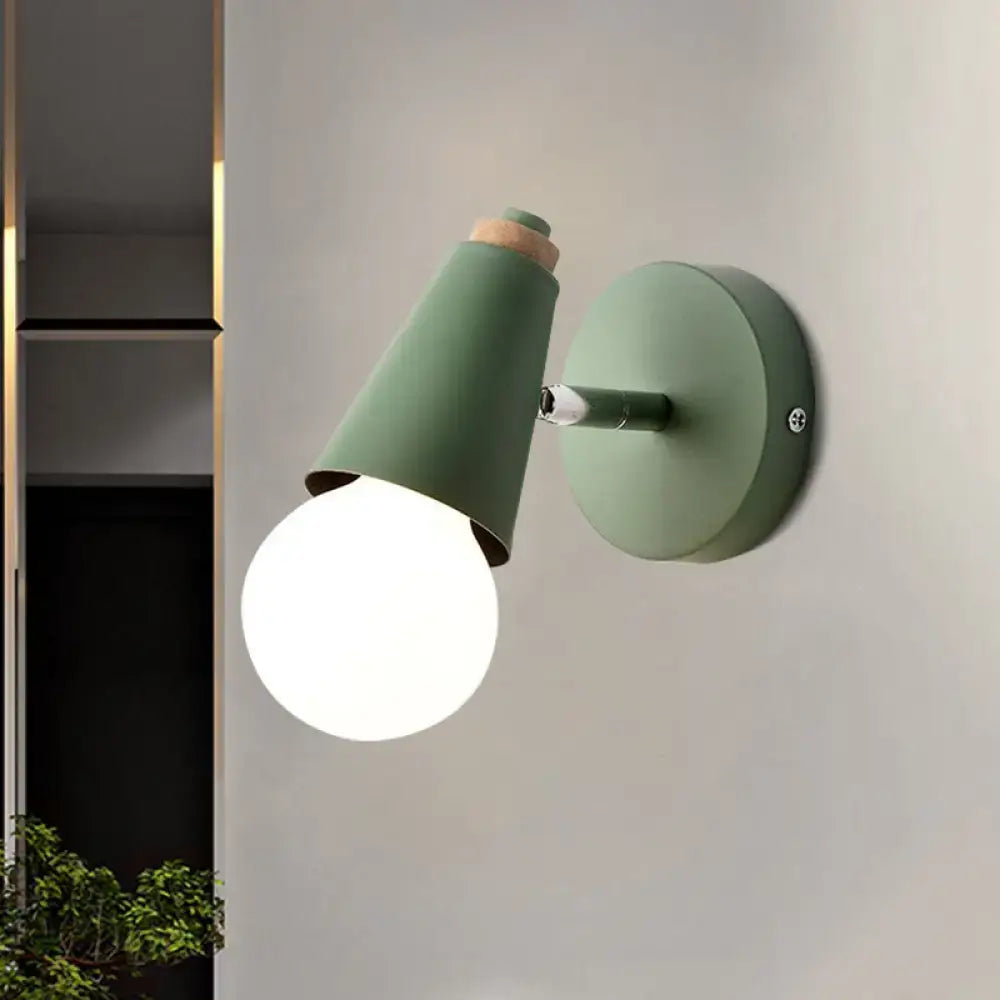 A matte sage green macaron loft sweet cone wall sconce with metal wood base and exposed bulb for corridor lighting