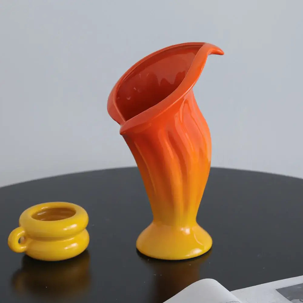 Vibrant orange and yellow gradient ceramic vase with fluted calla lily silhouette for decorbites calla lily decor