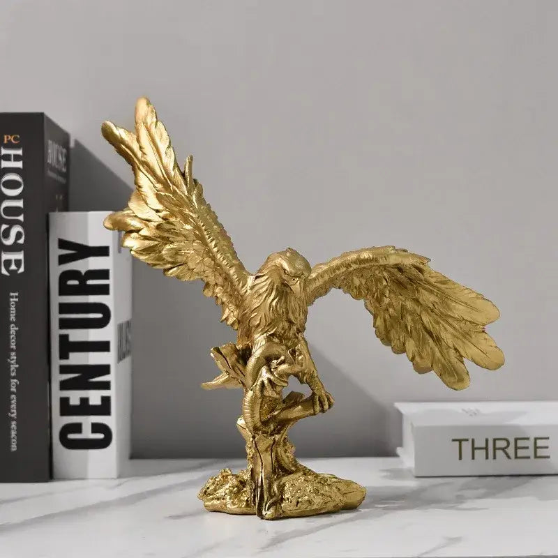 Majestic gold resin eagle sculpture with detailed feathered wings and metallic finish perched on rocky base for decor