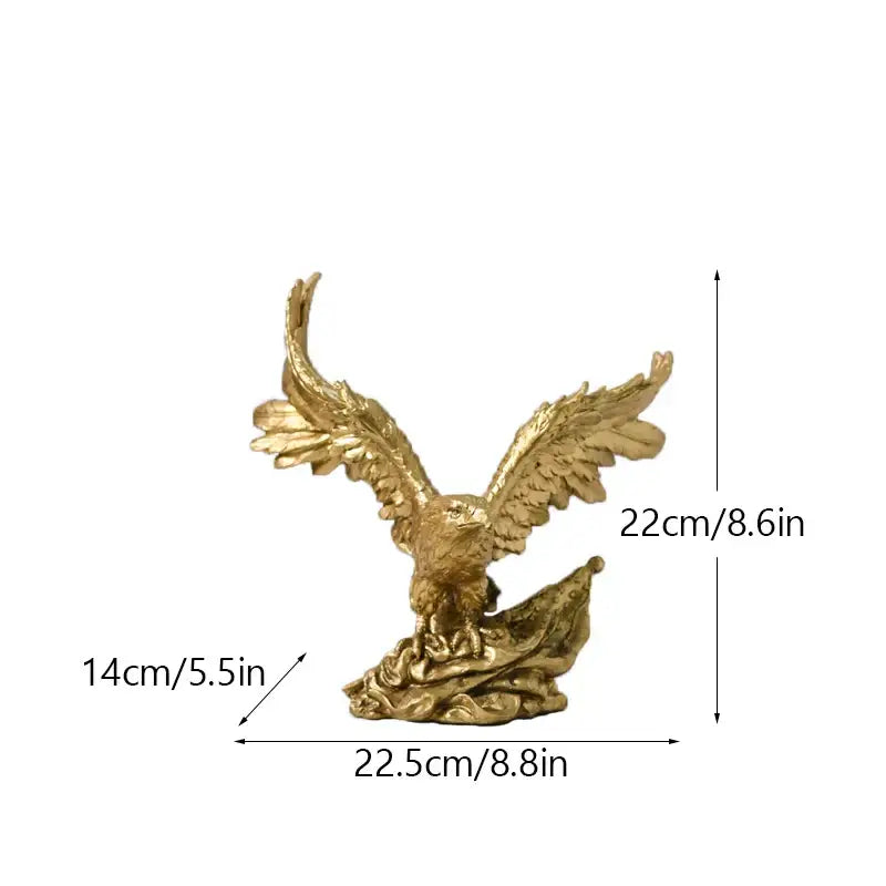 Majestic gold resin eagle sculpture with detailed feathered wings spread wide perched on a rocky base for decor