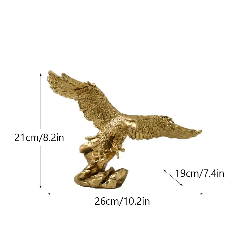 Majestic gold resin eagle sculpture with detailed feathering and textured wings perched on a rocky base for decor