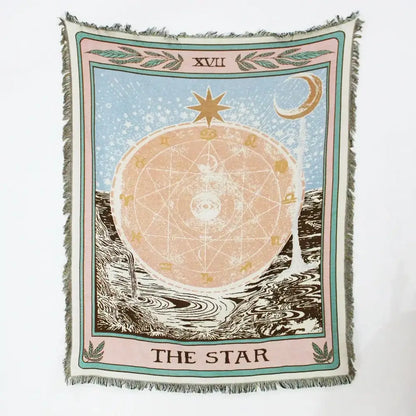 A soft woven geo tassel picnic mat and sofa cover featuring a star tarot card design with celestial motifs