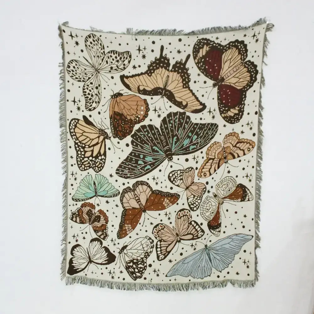 Mandala black geo tassel picnic mat and sofa cover featuring a cream woven tapestry with vibrant butterflies on starry background