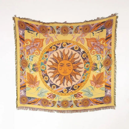 A vibrant yellow mandala black geo tassel picnic mat and sofa cover featuring a sun and floral woven tapestry design