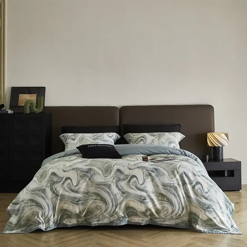 A luxurious bedding set with a swirling marble pattern in gray white and teal made from decorbites 100s egyptian cotton