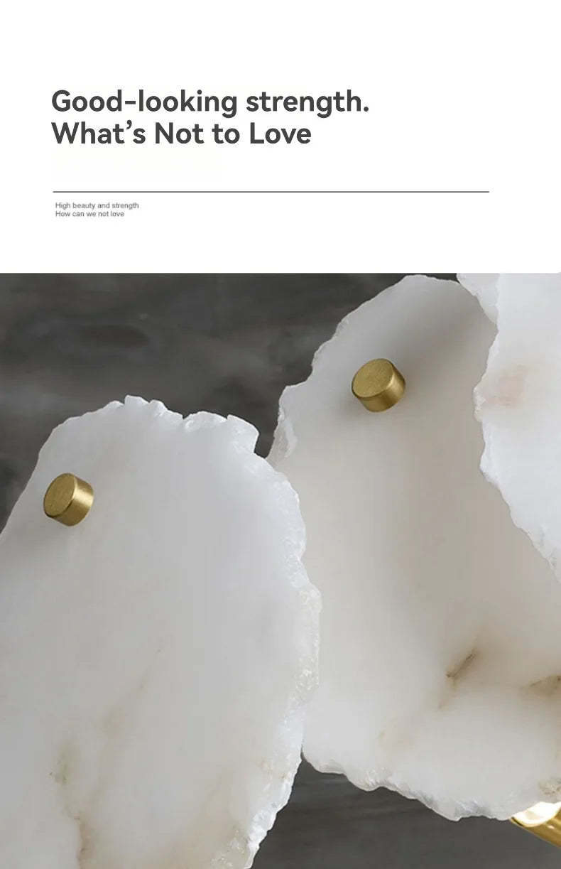 White irregular agate-like decorative trays with polished gold-toned knobs complement marble led chandelier pendant light designs
