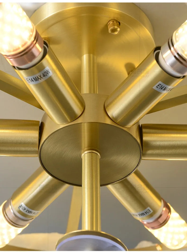 Gold-colored brass marble led chandelier round pendant light with multiple cylindrical arms and illuminated bulbs