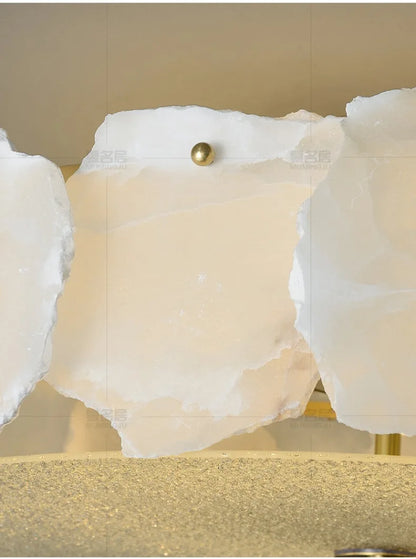 Marble led chandelier round pendant light featuring white translucent stone slabs with smooth polished surfaces and irregular edges