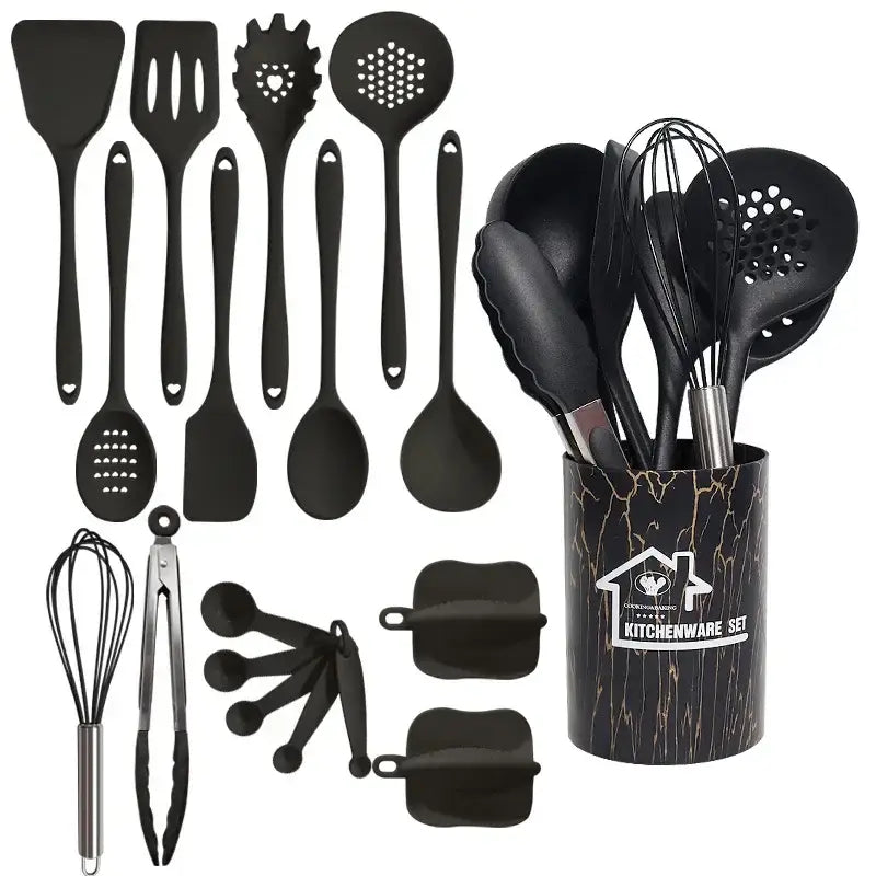 Black silicone cooking tool set in a black and gold marble-patterned cylindrical kitchen storage container