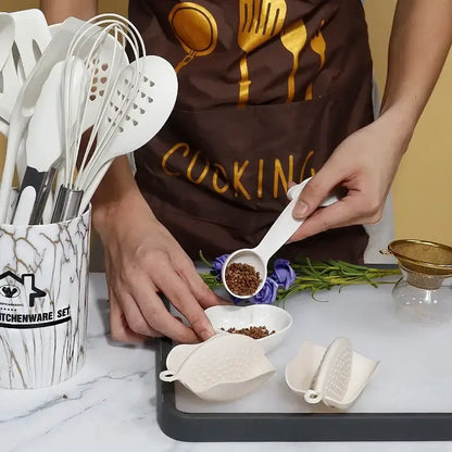 White silicone measuring spoon with smooth handle and shallow bowl from marble pink silicone cooking tool set for precise measurement