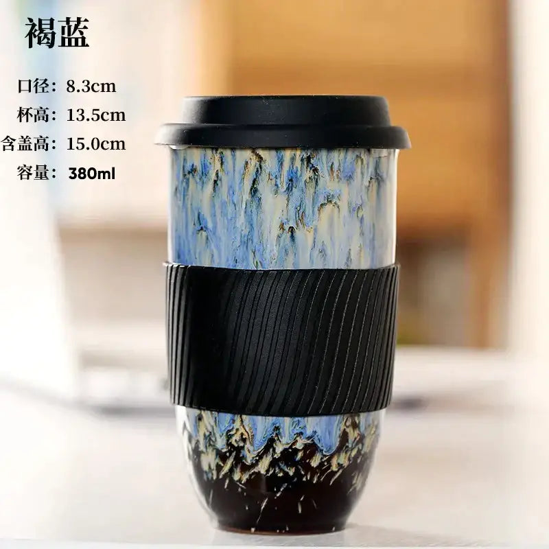 A decorbites ceramic kiln blue and white marbled ceramic kiln mug with black lid and silicone grip for travel use