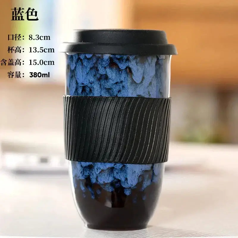 Blue marbled decorbites ceramic kiln mug with black lid and textured silicone grip for kitchen travel use