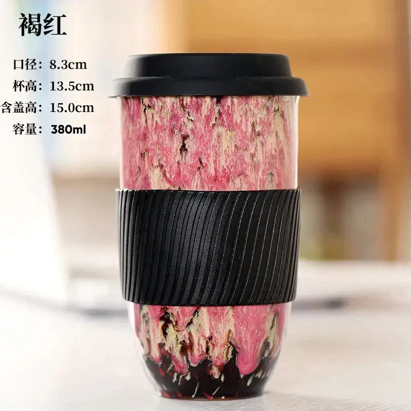 Pink and black marbled ceramic kiln mug with silicone grip and black lid for travel by decorbites ceramic kiln