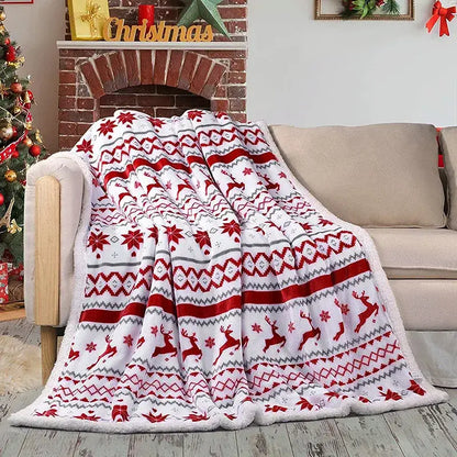 A cozy flannel blanket in white red and gray with reindeer and snowflake patterns for living room sofa by decorbites cozy