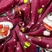 A maroon decorbites cozy flannel blanket with festive santa hats and snowflakes for living room sofa use