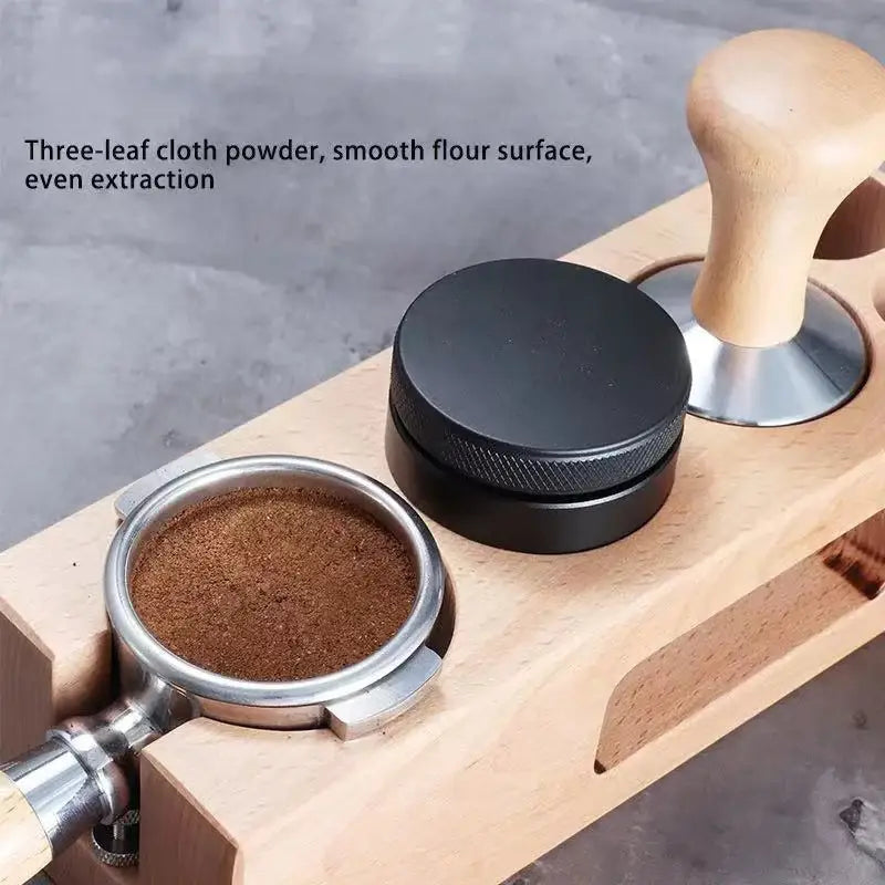 Matte black adjustable palm tamper made of textured metal with wooden handle for kitchen coffee distribution tool
