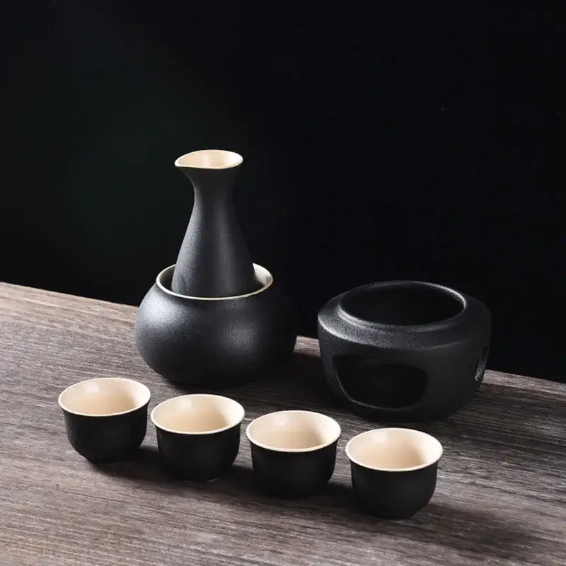 Matte black and light blue decorbites ceramic sake set with cream interior and matching warming pot for dining room use