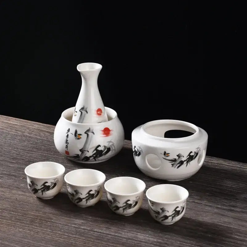 Matte black and light blue decorbites ceramic sake set with white bottles featuring black brushstroke and red accents