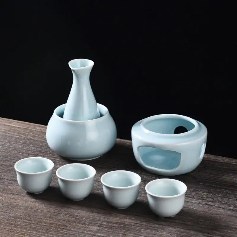 Light blue ceramic sake set with tall decanter four cups and oval warmer from decorbites ceramic sake collection