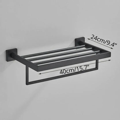 Matte black bathroom accessories set featuring a black matte finished metal towel rack with four bars and lower hanging loop