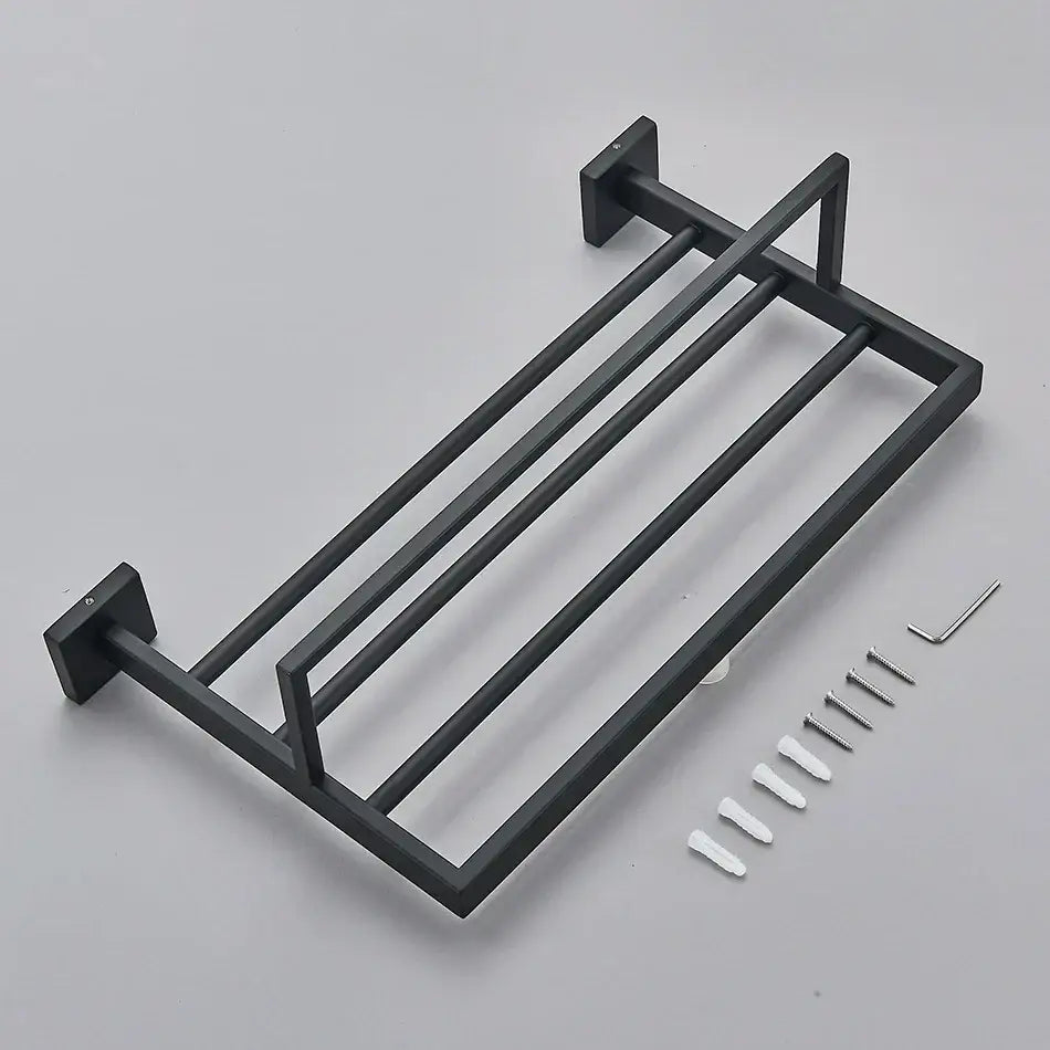 Matte black bathroom accessories set featuring a black matte-finished metal towel rack with four horizontal bars and wall mounts