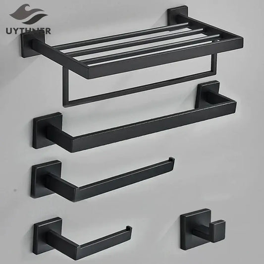 Matte black bathroom accessories set featuring a black matte metal towel rack and matching hooks for decorbites black bathroom
