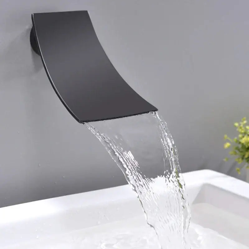 Matte black bathroom waterfall faucet with sleek curved design and handheld showerhead decorbites black bathroom
