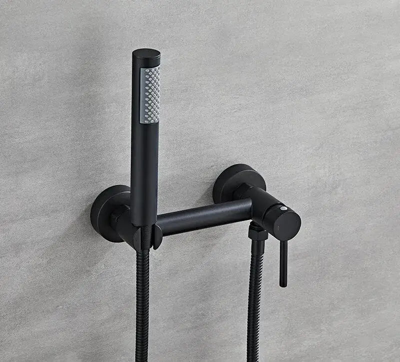Matte black bidet faucet set with handheld sprayer featuring a sleek wall-mounted design and textured spray head