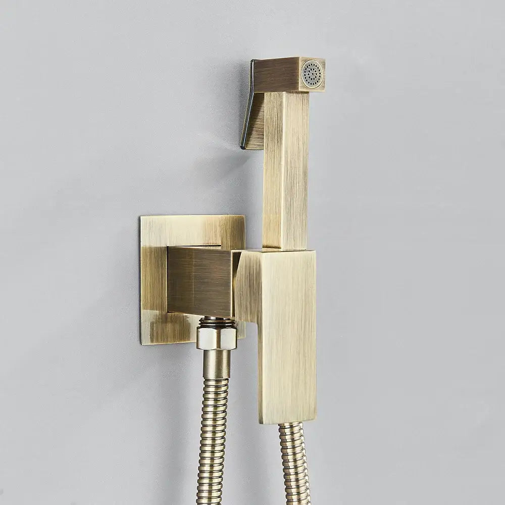 Matte black brass bidet faucet with handheld spray featuring a brass-finished square shower nozzle and flexible braided hoses