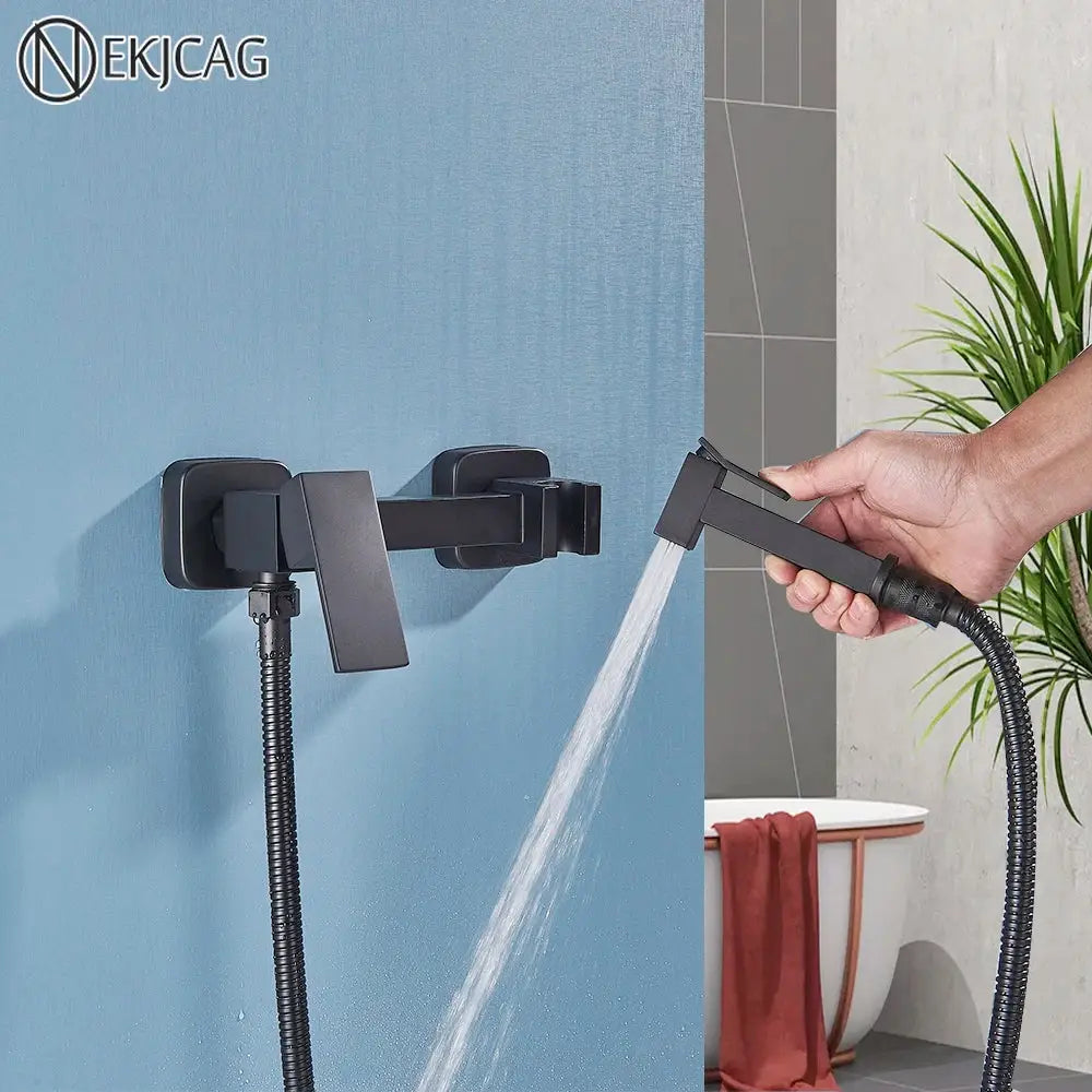 Matte black brass bidet sprayer with sleek rectangular wall-mounted shower faucet and flexible hose for bathroom use