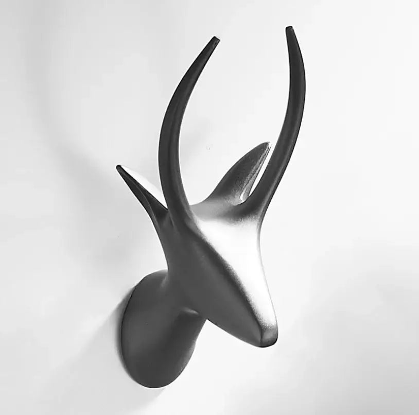 Matte black brass gray deer hook wall decor with sleek curved antlers for entryway hanging by decorbites brass gray