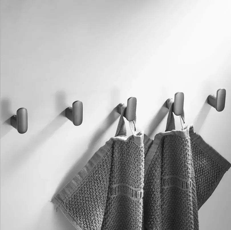 Matte black brass gray deer hook with modern matte finish holding textured gray towels for entryway decorbites brass gray