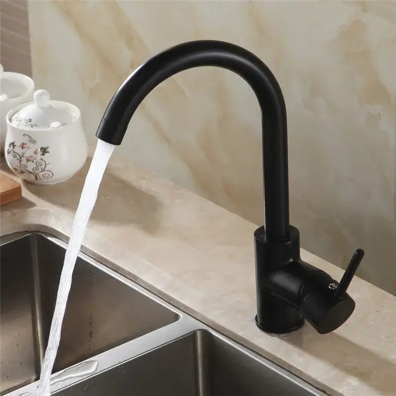 Matte black brass kitchen faucet with a curved swivel spout and single lever handle for modern kitchen setups