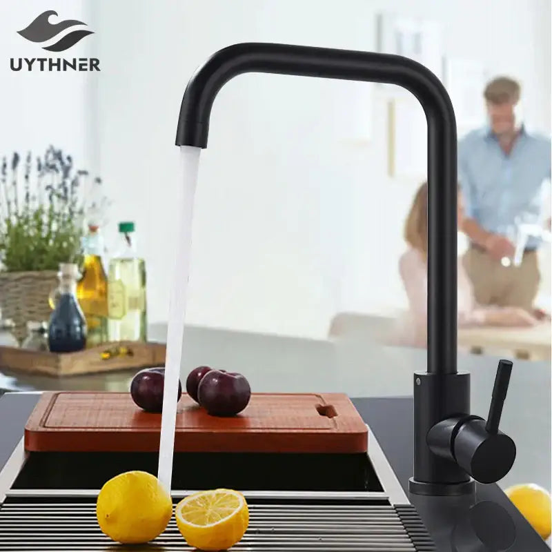 Matte black decorbites kitchen faucet with curved spout and single lever handle in a modern kitchen faucet design
