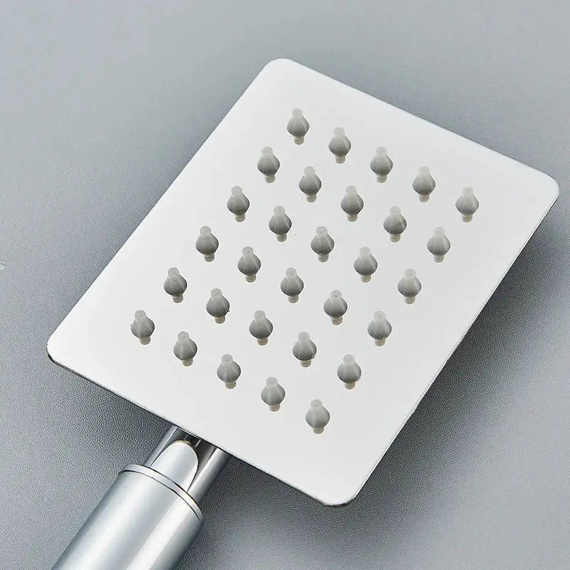 Matte black and brushed silver stainless steel handheld shower head with square brushed stainless steel shower head and rounded nozzles
