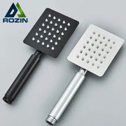 Two square stainless steel handheld shower heads in matte black and brushed silver finish for bathroom use