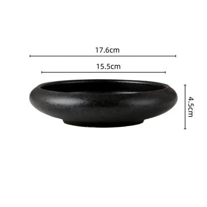 Black ceramic bowl with smooth rounded edges and matte finish from decorbites ceramic vase sword mountain set decor