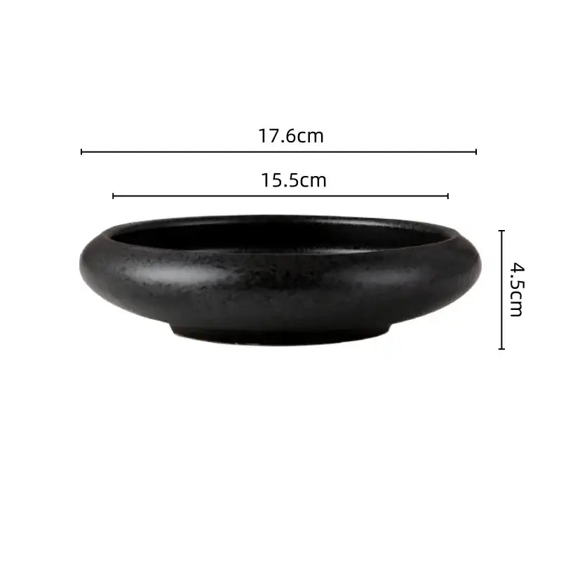 Black ceramic bowl with smooth rounded edges and matte finish from decorbites ceramic vase sword mountain set decor