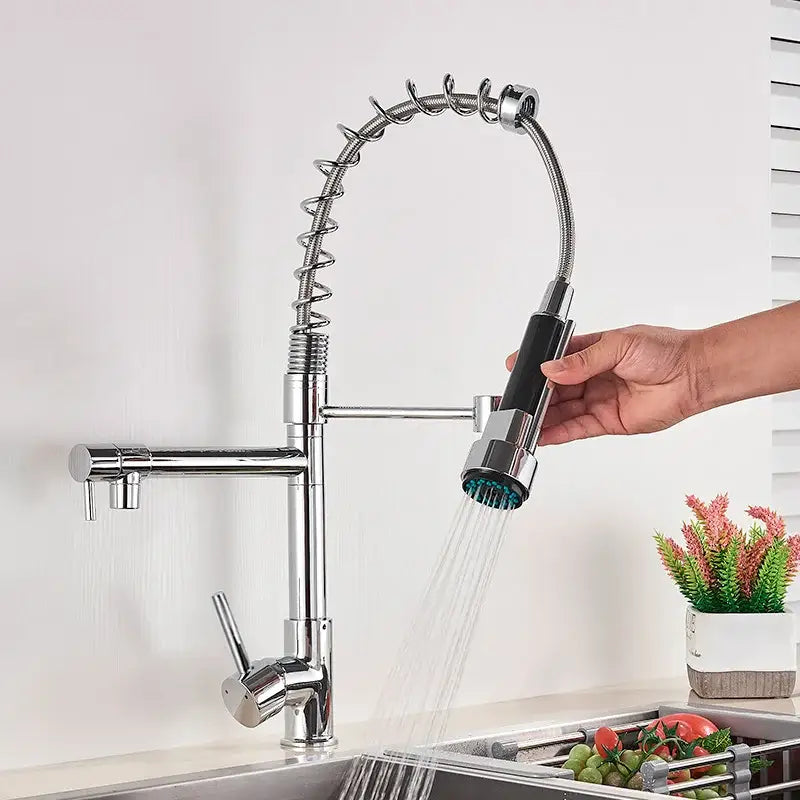 Chrome-finished kitchen faucet with flexible coiled hose and black grip spray head for decorbites brass swivel spout use