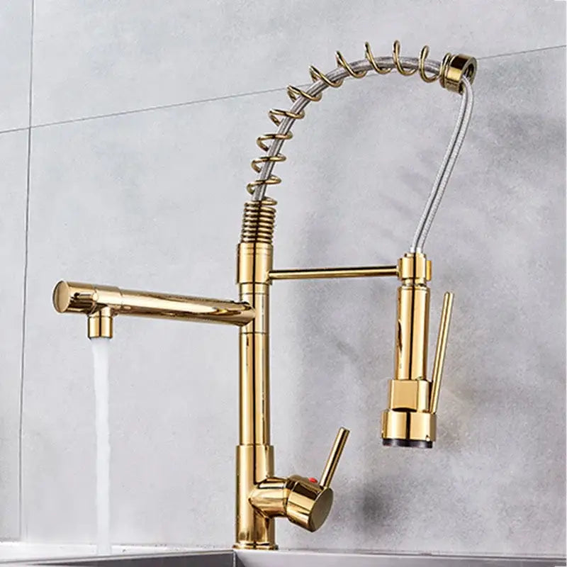 Matte black decorbites brass kitchen faucet with swivel spout featuring a gold-colored flexible coiled spring hose and dual spray heads