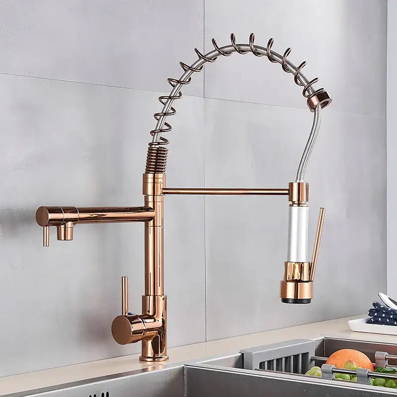 Rose gold kitchen faucet with flexible coiled hose and pull-down spray head in decorbites brass kitchen faucet with swivel spout