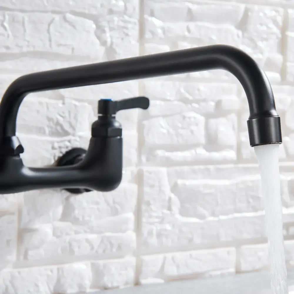 Matte black dual handle kitchen faucet with swivel hot cold water tap featuring curved spout and blue accent handle