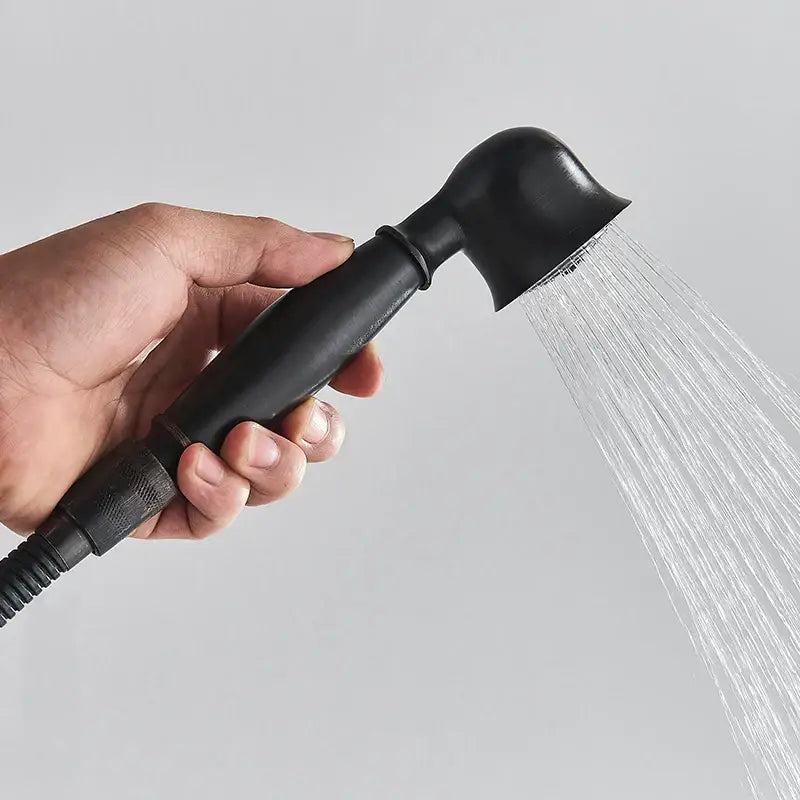 Matte black dual handle shower mixer with a black matte finish handheld showerhead and ergonomic textured grip