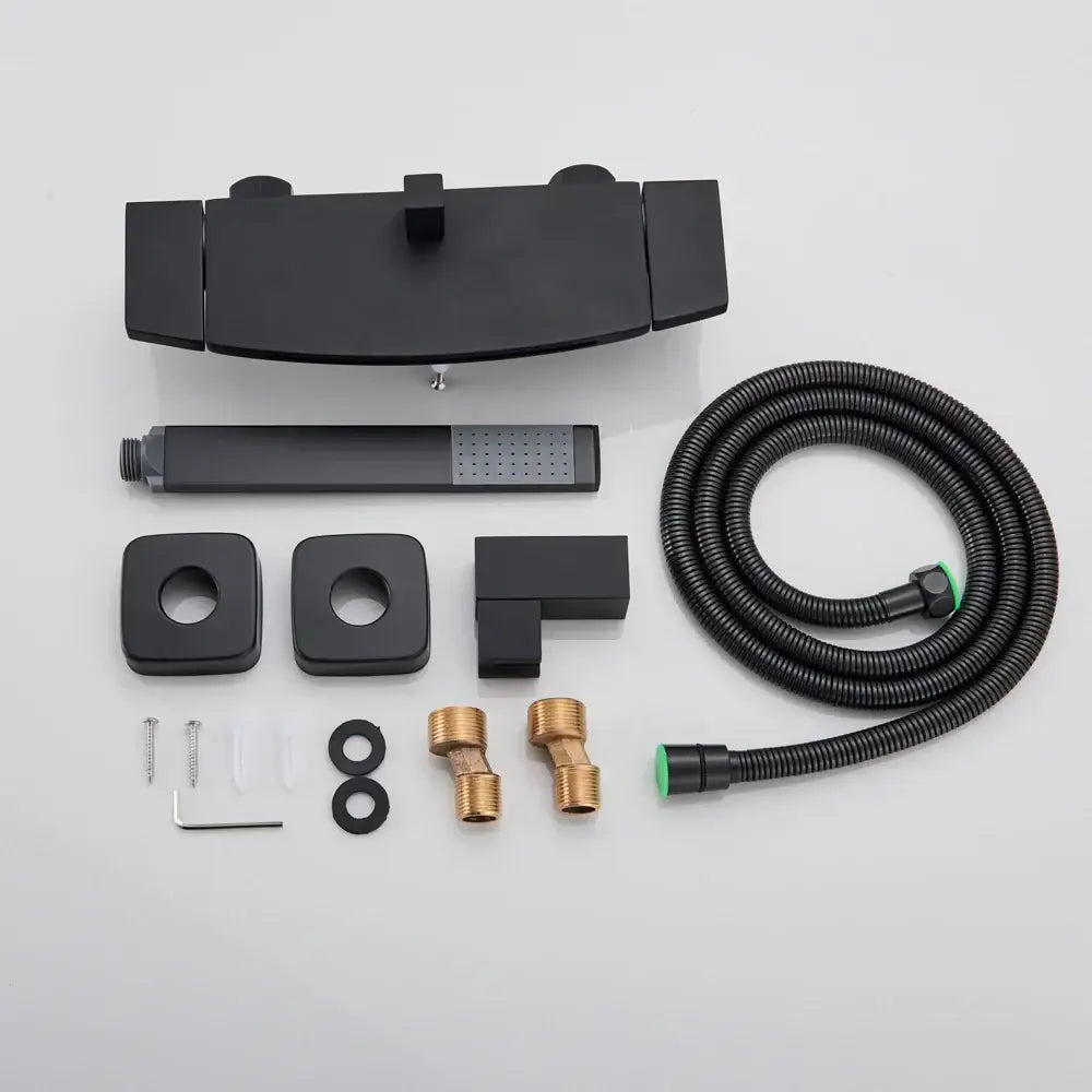 Matte black dual handle waterfall mixer tap with handshower featuring rectangular wall-mounted faucet and coiled hose by decorbites
