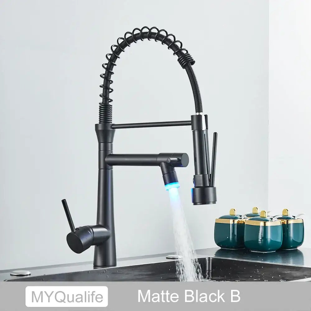 Matte black flexible led kitchen faucet with dual spout mixer featuring a coiled spout and blue led lighting